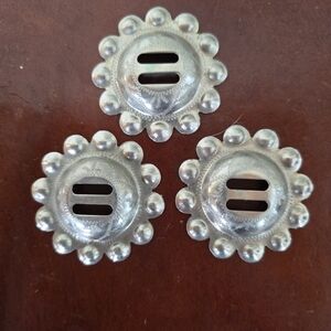 Set of Three Vintage signed Ricardo metal slotted conchos with scalloped edges.